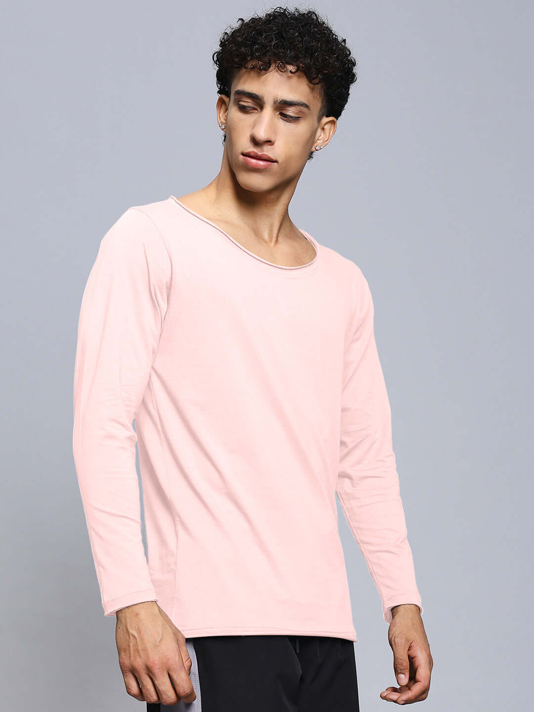 Model wearing Joel slim fit sweatshirt in baby pink, crafted from premium 100% cotton fabric, showcasing a stylish and comfortable look.