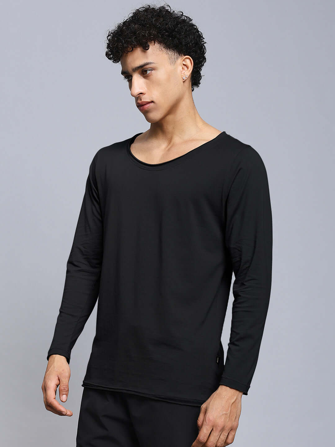 Model wearing Joel Slim Fit Sweatshirt in black, made from 100% cotton. Premium heavyweight fabric, ideal for casual and stylish wear.