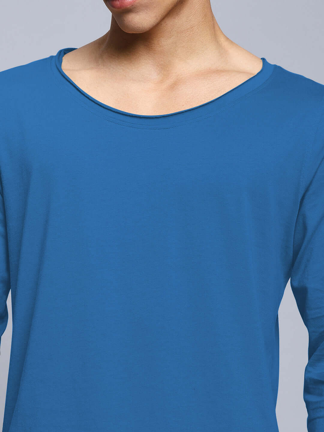 Man wearing a royal blue slim fit sweatshirt, made of 100% cotton, highlighting the quality fabric and stylish design, perfect for casual wear.