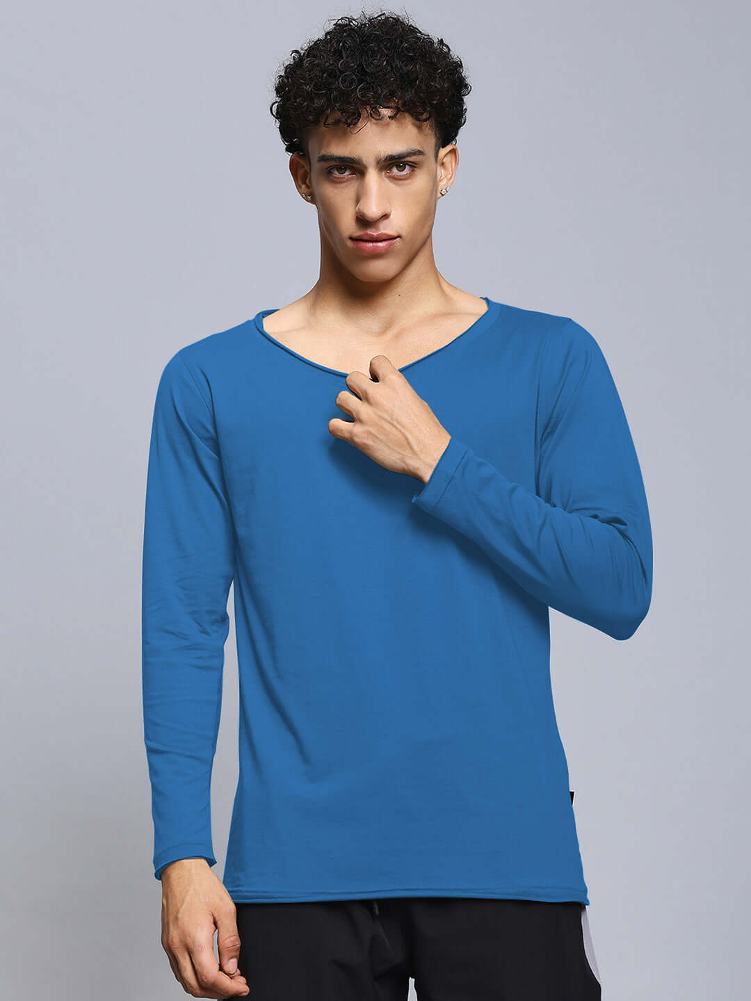 Model wearing Joel slim fit sweatshirt in royal blue, 100% cotton, long-sleeve design. Premium heavy gauge fabric, 190 GSM. Casual wear.