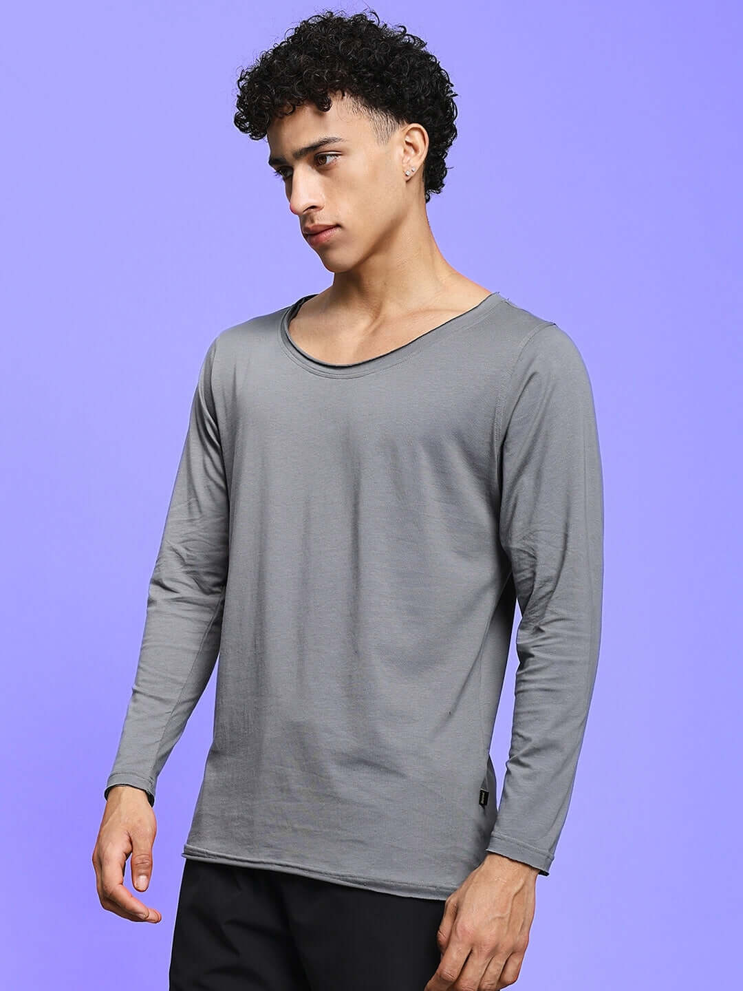 Model wearing Joel slim fit grey sweatshirt, premium 100% cotton, bio-washed fabric. Ideal for cold machine wash. Made in India.