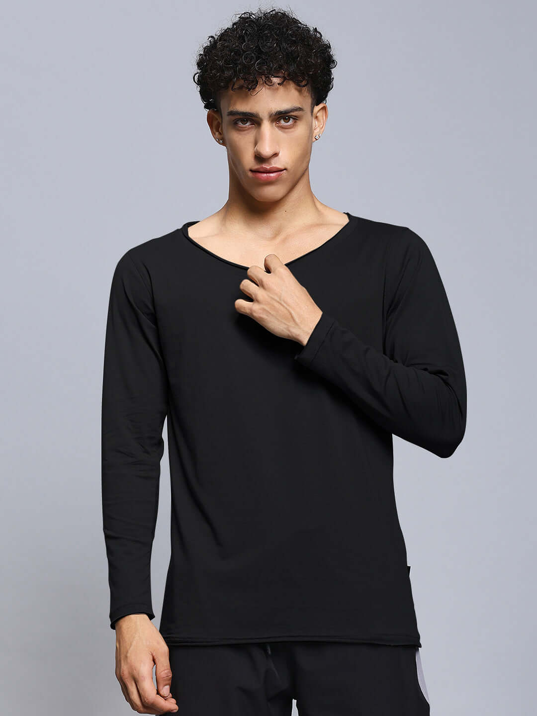 Model wearing Joel Slim Fit Black Sweatshirt, 100% cotton, bio-washed, premium quality, from Color By Colours.