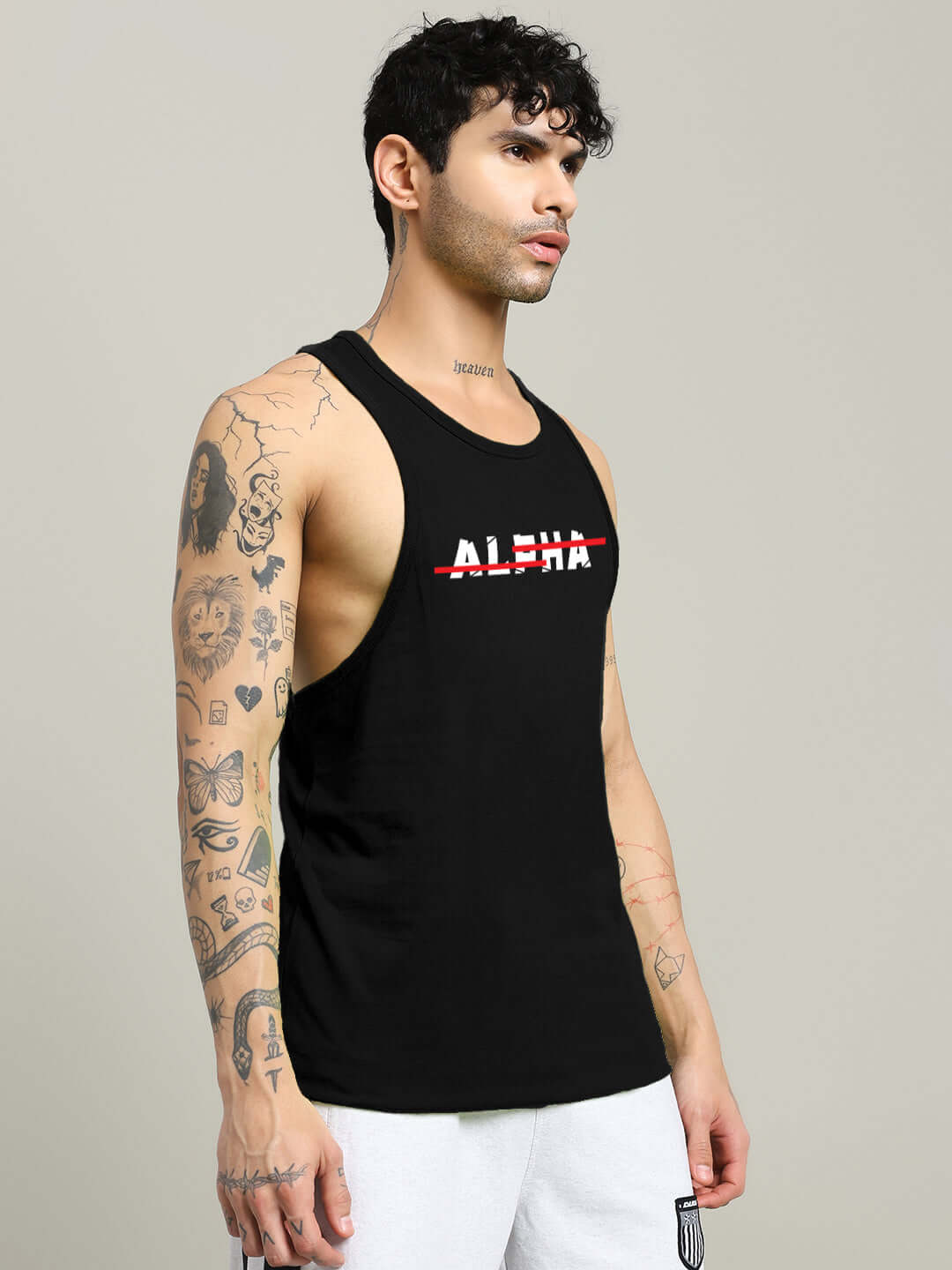 Man wearing JOJO ALPHA PRINTED GYM T-SHIRT BLACK with bold 'Alpha' graphic, showcasing fitness and style in classic black.