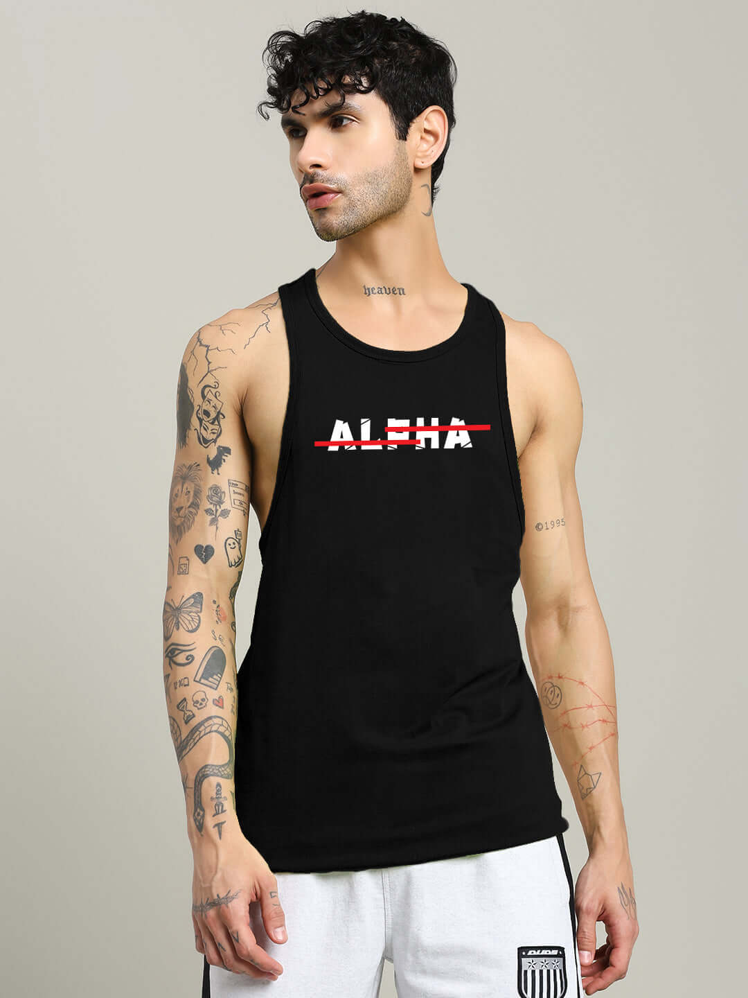 Model wearing JOJO Alpha printed black gym t-shirt, showcasing fit and design.