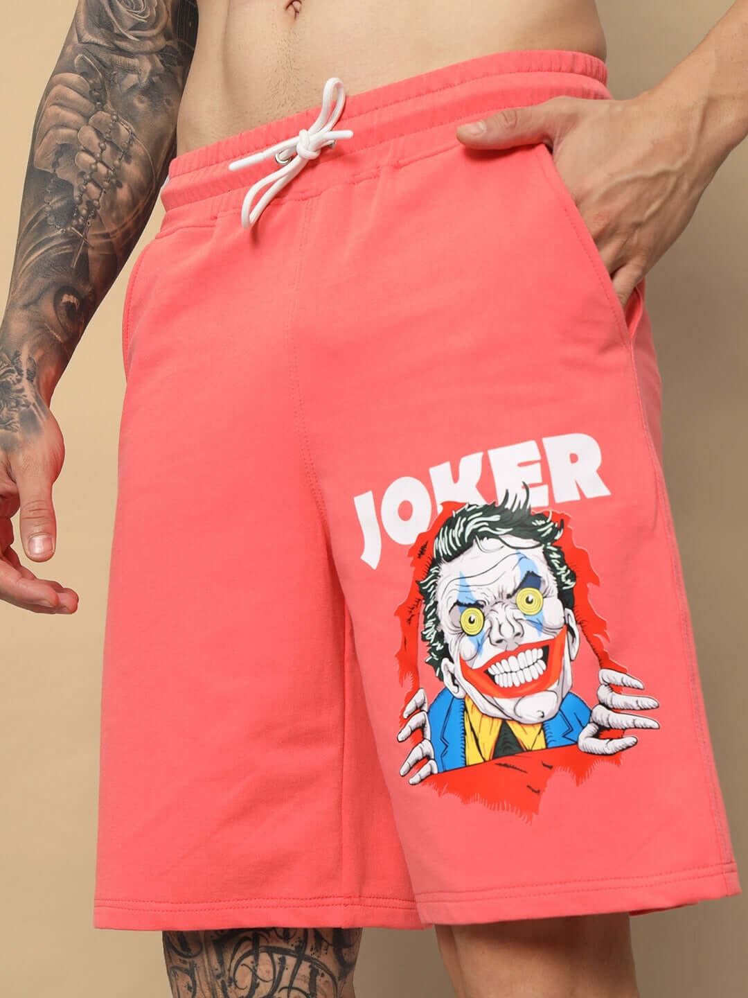 Joker Regular Fit Shorts in Pantone Peach with bold graphic design and drawstring waistband, customizable for a perfect fit.