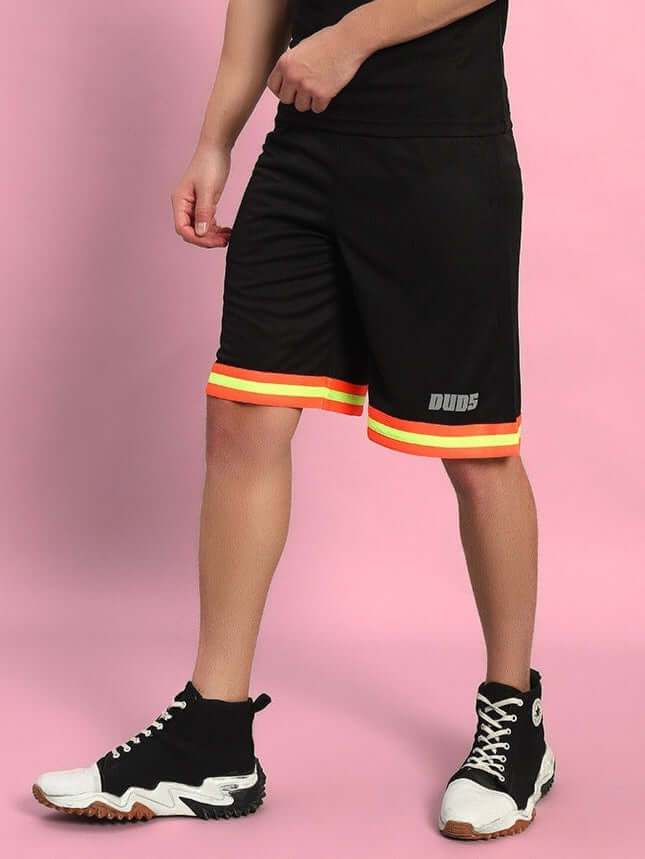 Person wearing JORDAN REGULAR FIT SHORTS BLACK with colorful trim, suitable for sports, workouts, or casual wear.