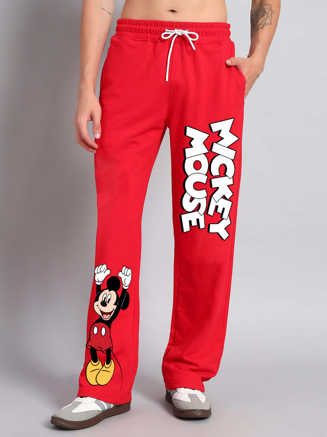 Red Mickey Mouse jogger pants by DUDS, featuring relaxed fit and customization options, made to order by skilled tailors.