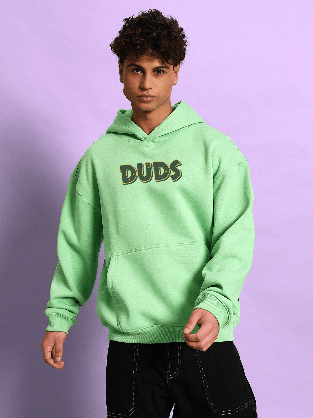 Model wearing JUDY NICK ZOOTOPIA FLEECE HOODIE GREEN showcasing bold character fashion in vibrant green.