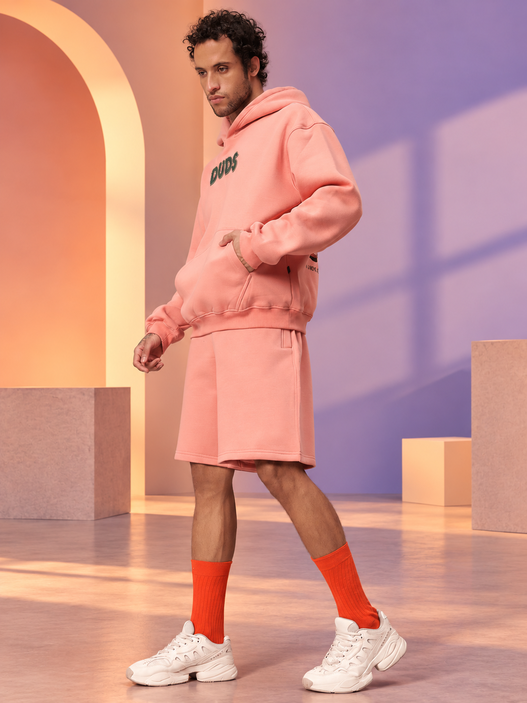 JUDY NICK ZOOTOPIA FLEECE CO-ORD PEACH unisex hoodie and shorts set styled with orange socks and white sneakers