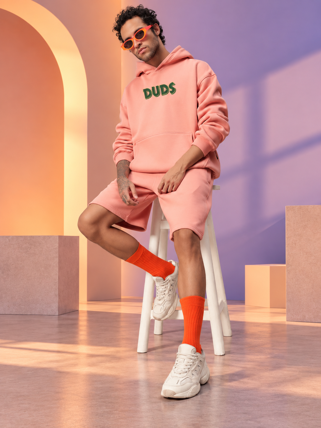 JUDY NICK ZOOTOPIA FLEECE CO-ORD PEACH unisex hoodie and shorts set styled with orange socks and sneakers