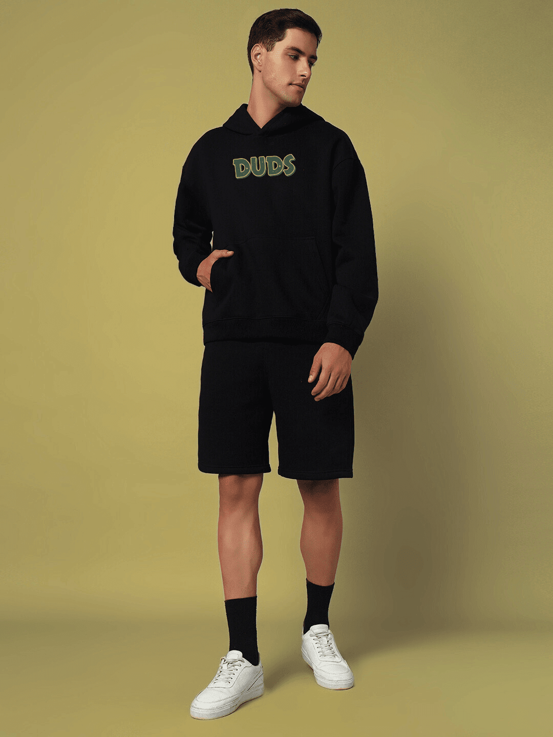 Model wearing JUDY NICK ZOOTOPIA FLEECE CO-ORD BLACK unisex outfit, featuring a playful streetwear style with a cozy fleece design.