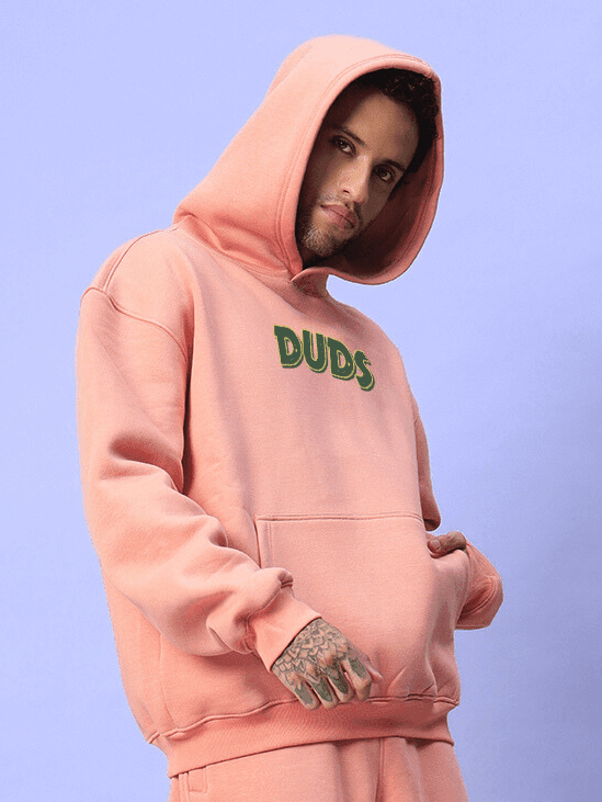 JUDY NICK ZOOTOPIA FLEECE HOODIE PEACH unisex hoodie with playful style featuring iconic characters on a warm peach toned fabric.