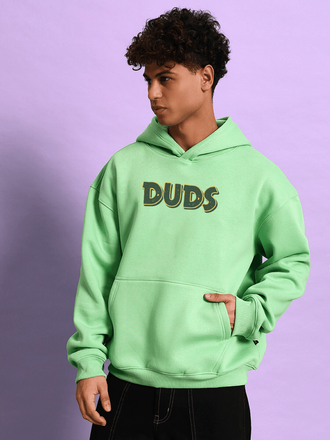 JUDY NICK ZOOTOPIA FLEECE HOODIE GREEN modeled by a person, showcasing the playful unisex design and bold character fashion style.