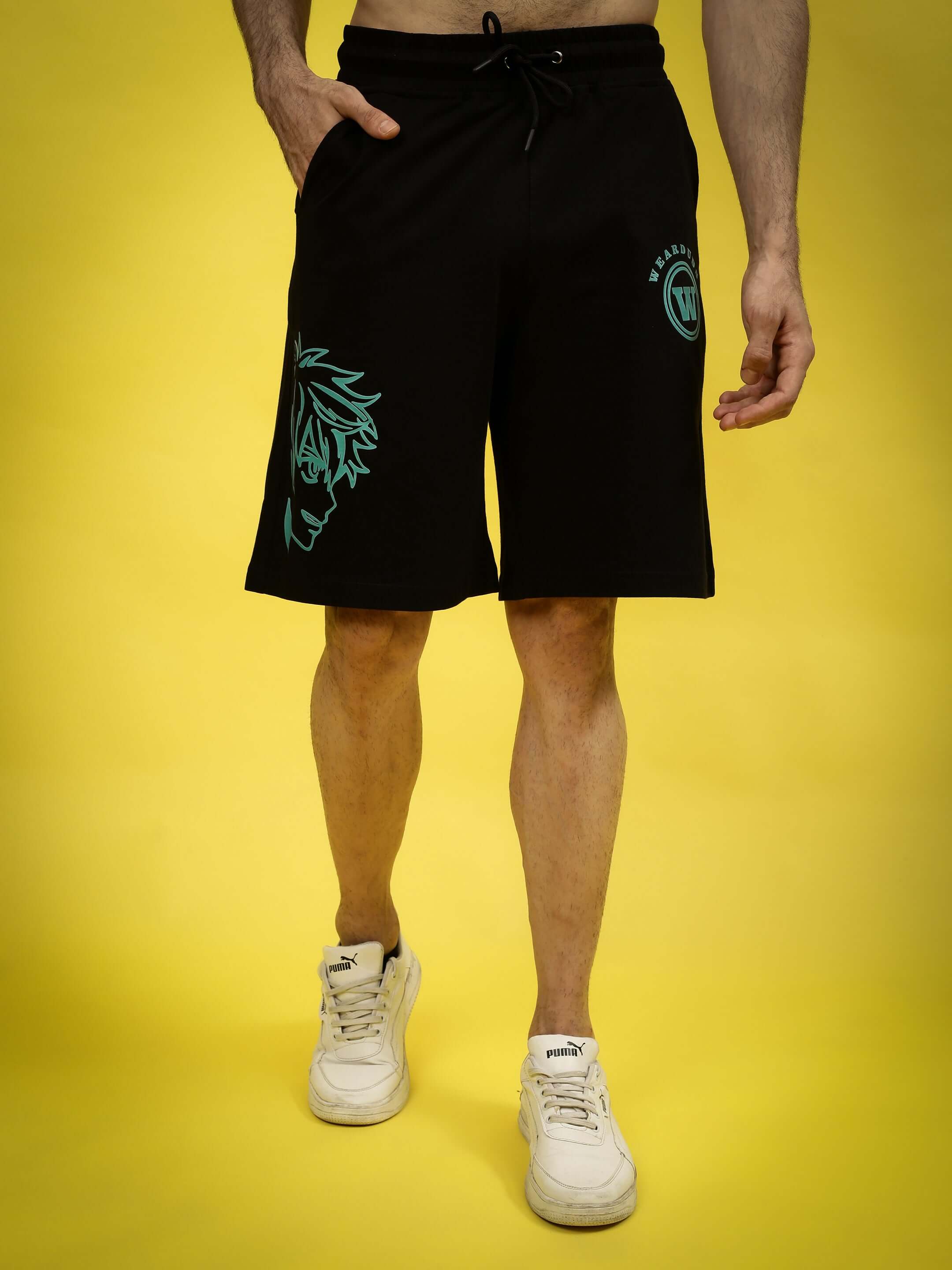Model wearing Kakashi regular fit black shorts with anime design, available for custom fit in prepaid orders. Casual, stylish men's apparel.