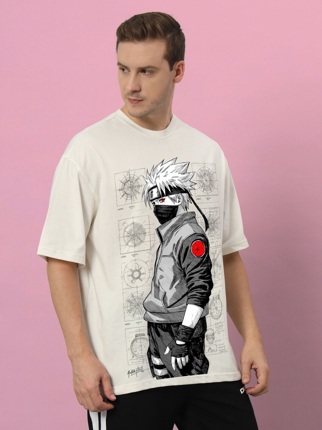 Model wearing KAKASHI PRINTED OVERSIZED T-SHIRT OFF-WHITE with anime design on front.