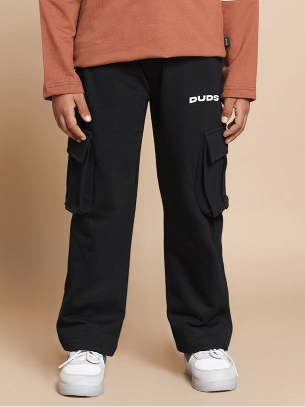 Child wearing DUDS black jogger pants with cargo pockets, perfect for boys and girls. Made to order for comfort and style.