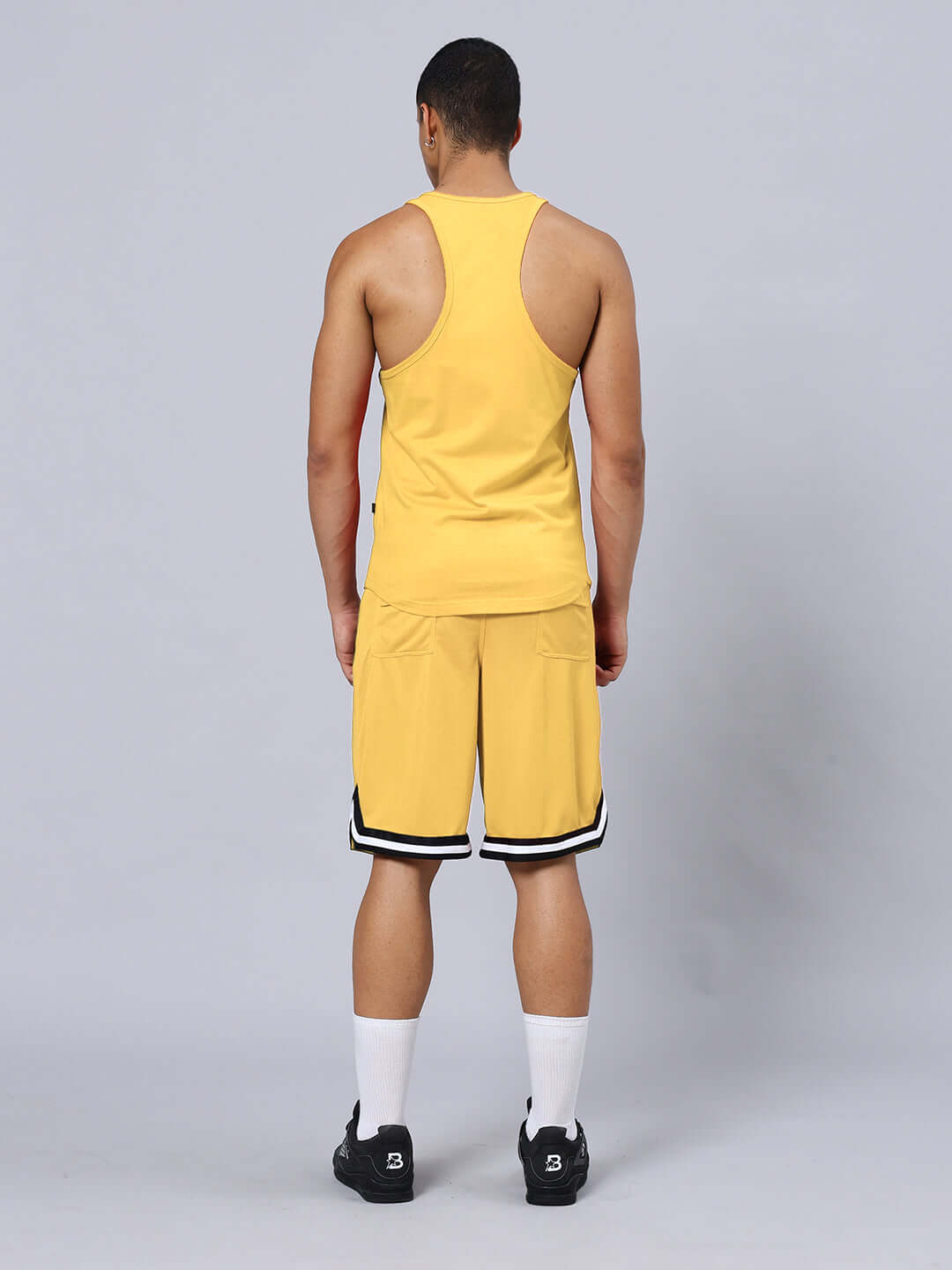 Back view of KETTLEBELL SKULL PRINTED GYM CO-ORD SET YELLOW in premium cotton and sports polyester.