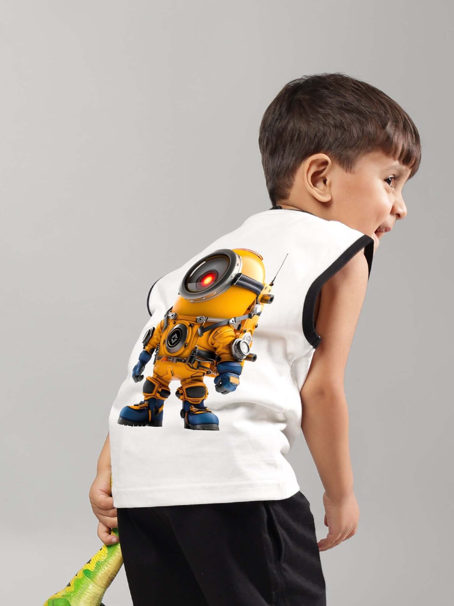Boy wearing off-white KEVIN summer T-shirt with a robot print on the back, customizable size available, made by DUDS tailors.