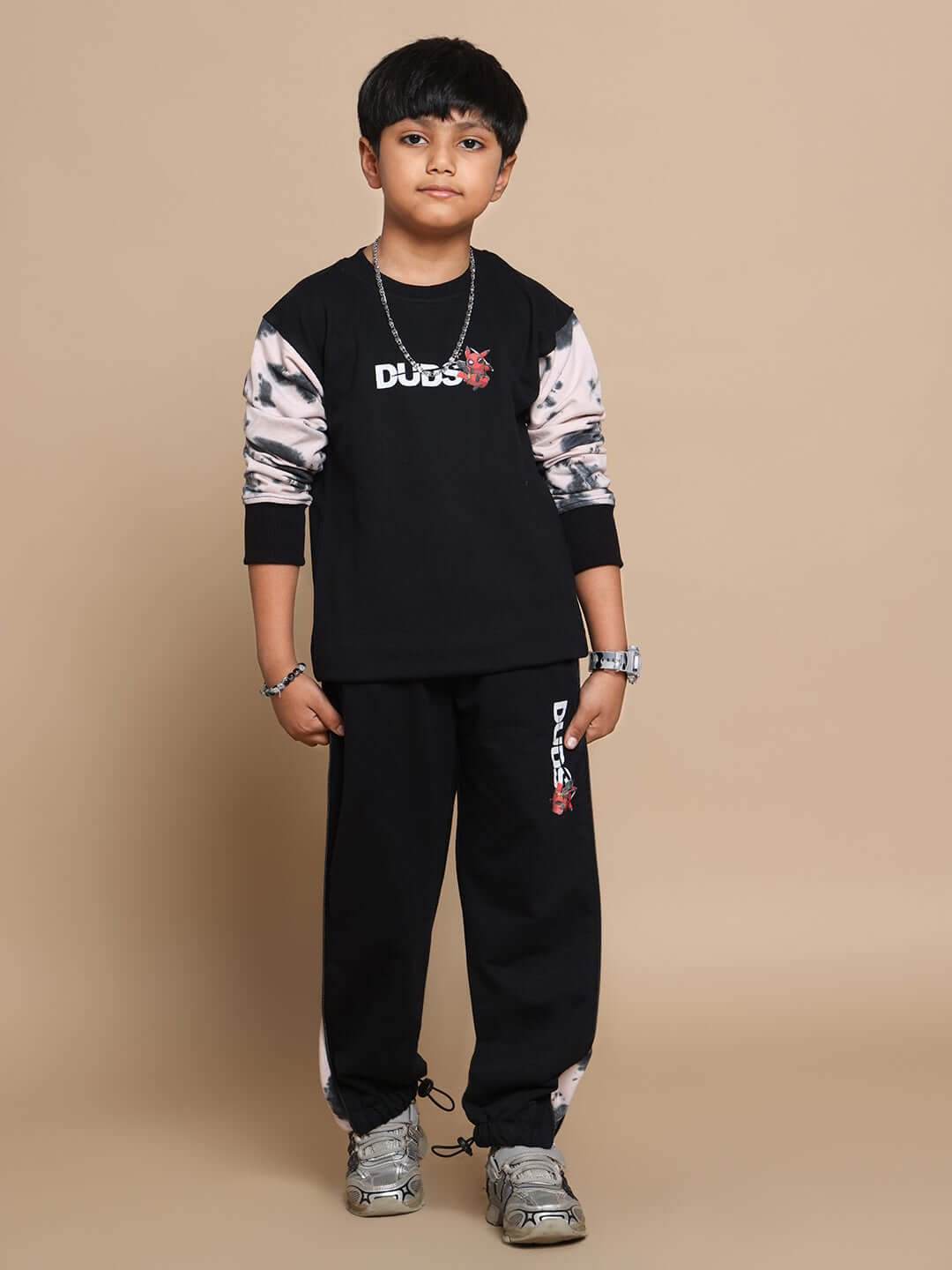 Young boy wearing Deadpool co-ord set in black-beige by DUDS, featuring comfortable and stylish made-to-order design for boys and girls.