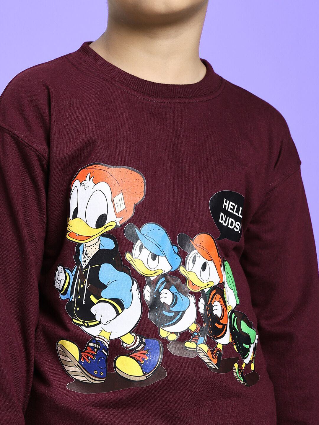 Child wearing SCHOOL DAYS CO-ORD FOR BOYS GIRLS MAROON with cartoon print, highlighting style and comfort for school and casual outings.