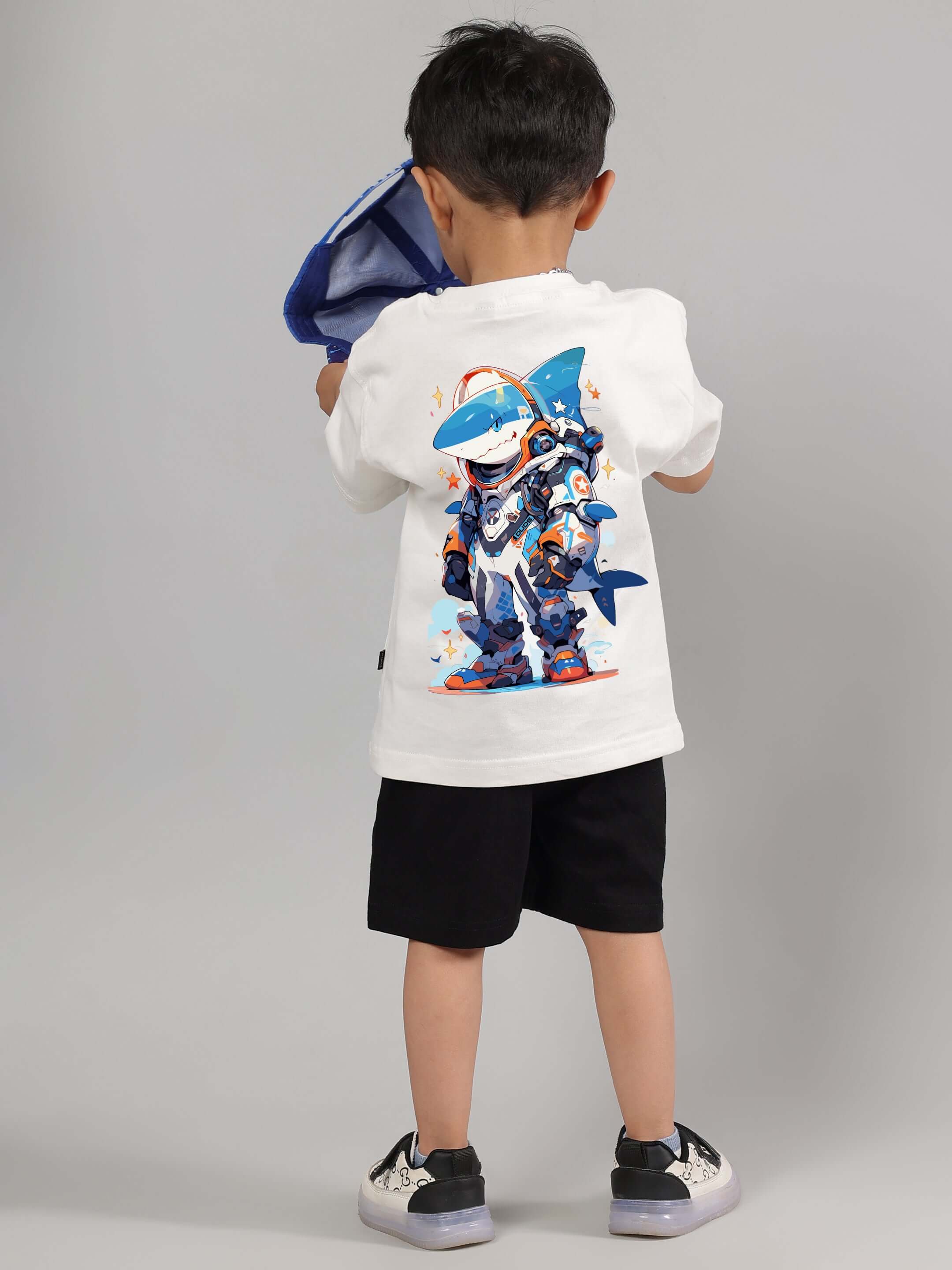 Child wearing ROBO SHARK CO-ORD FOR BOYS GIRLS WHITE-BLACK with vibrant shark graphic, showcasing trendy streetwear outfit.