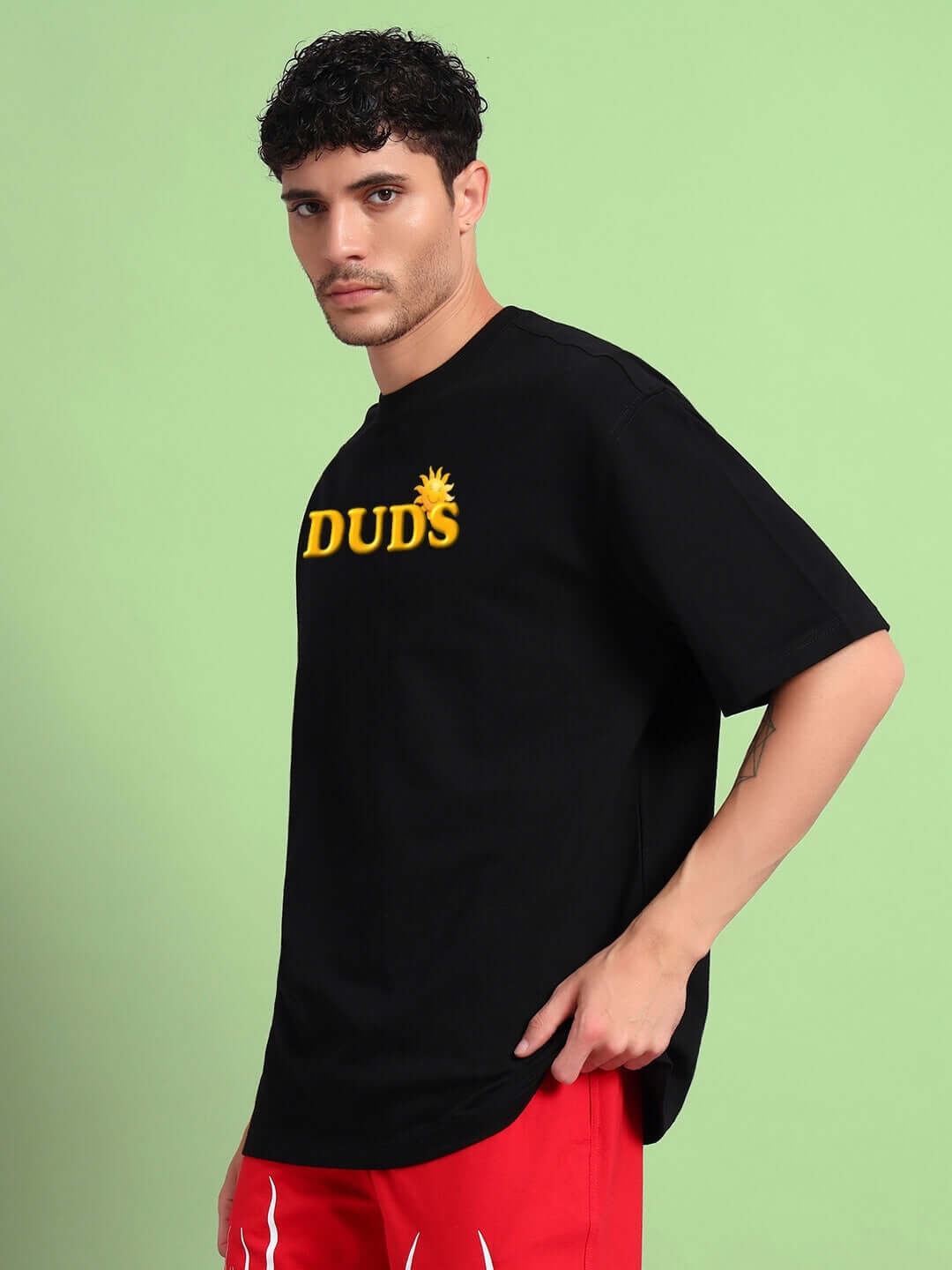Man wearing LABUBU MONSTERS OVERSIZED T-SHIRT BLACK with monster graphics, styled in casual street fashion