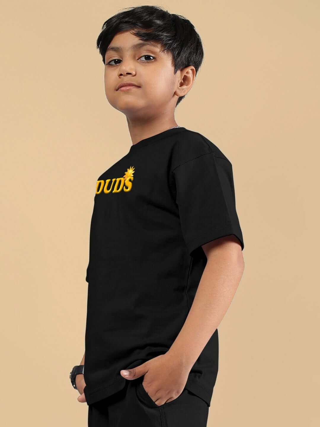 Young boy wearing LABUBU MONSTERS T-SHIRT FOR BOYS GIRLS BLACK, featuring playful monster graphics on a soft cotton fabric.
