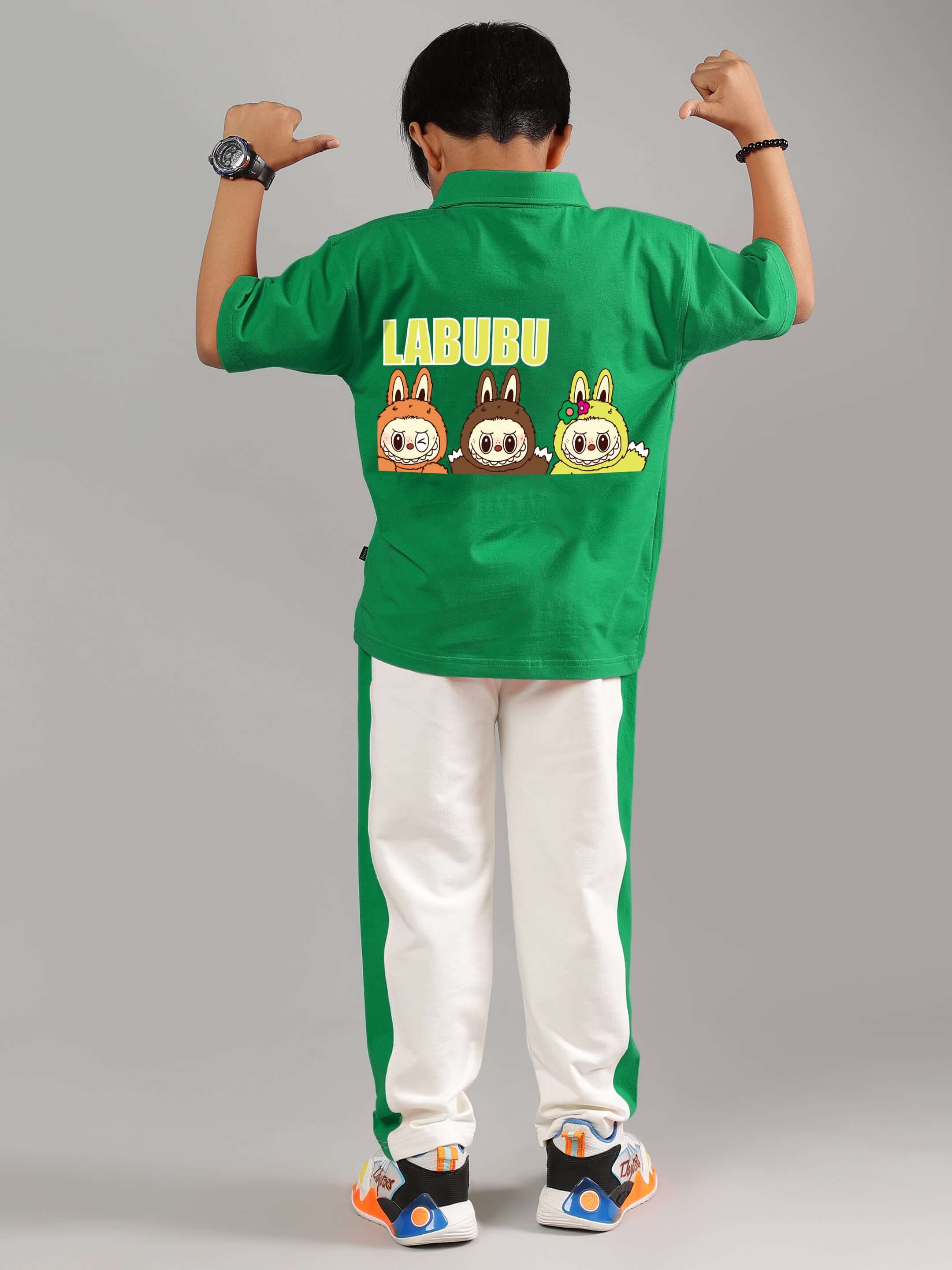 Child wearing LABUBU green and off-white co-ord set with cartoon design on the back, ideal for boys and girls, made to order by DUDS.