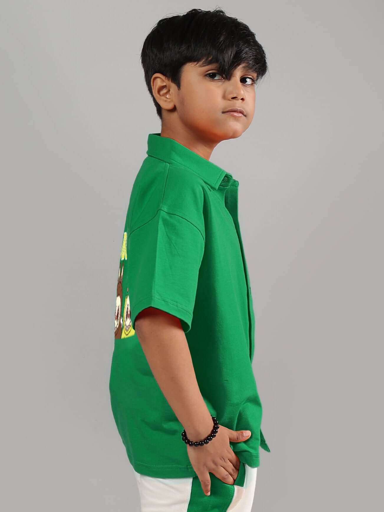 Child wearing LABUBU MYSTERY SHIRT FOR BOYS GIRLS GREEN, side view showing playful and bold design, ideal for fun and everyday wear.