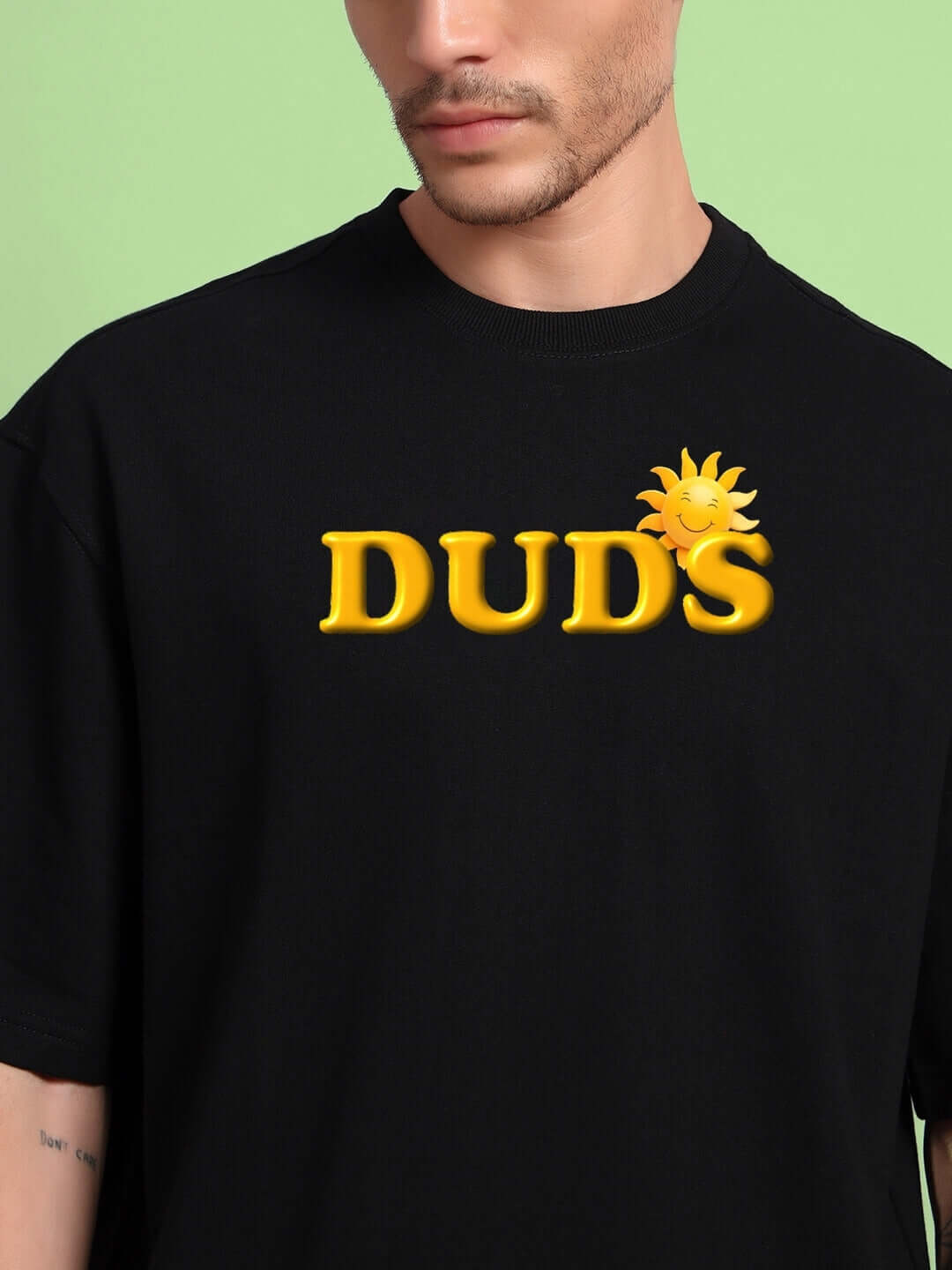Person wearing LABUBU MONSTERS OVERSIZED T-SHIRT BLACK with sun graphic