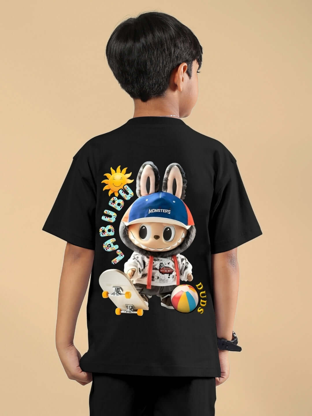 Child wearing black Labubu Monsters t-shirt featuring playful cartoon design for boys and girls.
