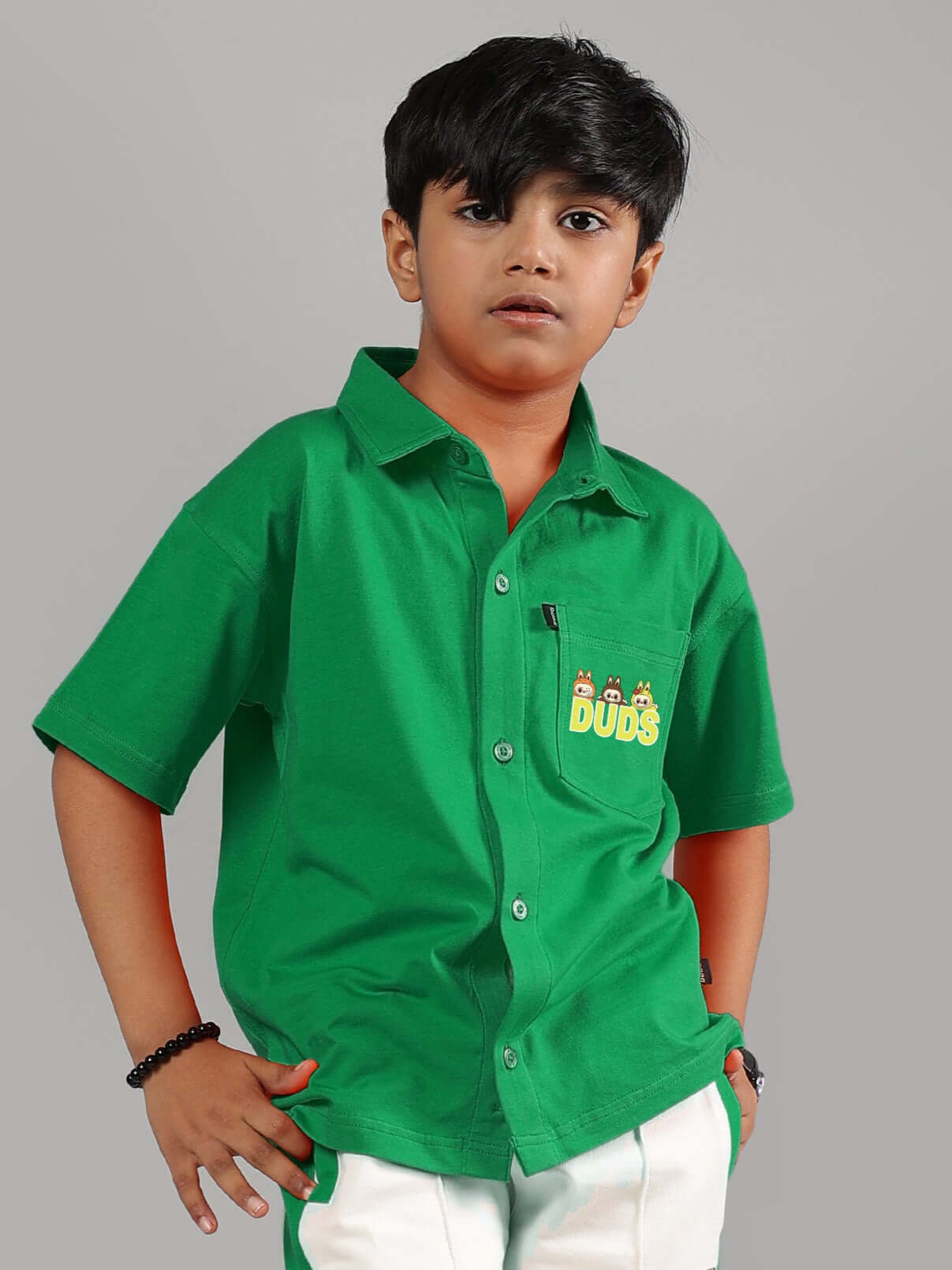Boy wearing LABUBU green mystery shirt for boys & girls, custom fit option available, made by DUDS tailors, shipping in 7-10 days.