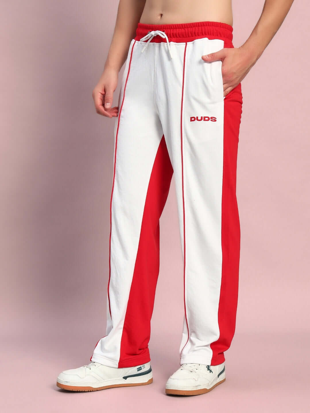 Model wearing Lagoon Relaxed Fit Joggers in white and red by DUDS, featuring a sporty design and comfortable fit.