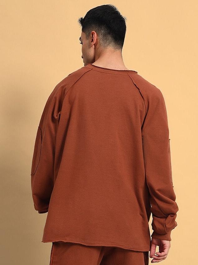 Back view of person wearing Lamina oversized brown sweatshirt made of premium cotton French terry lycra, comfortable fit.