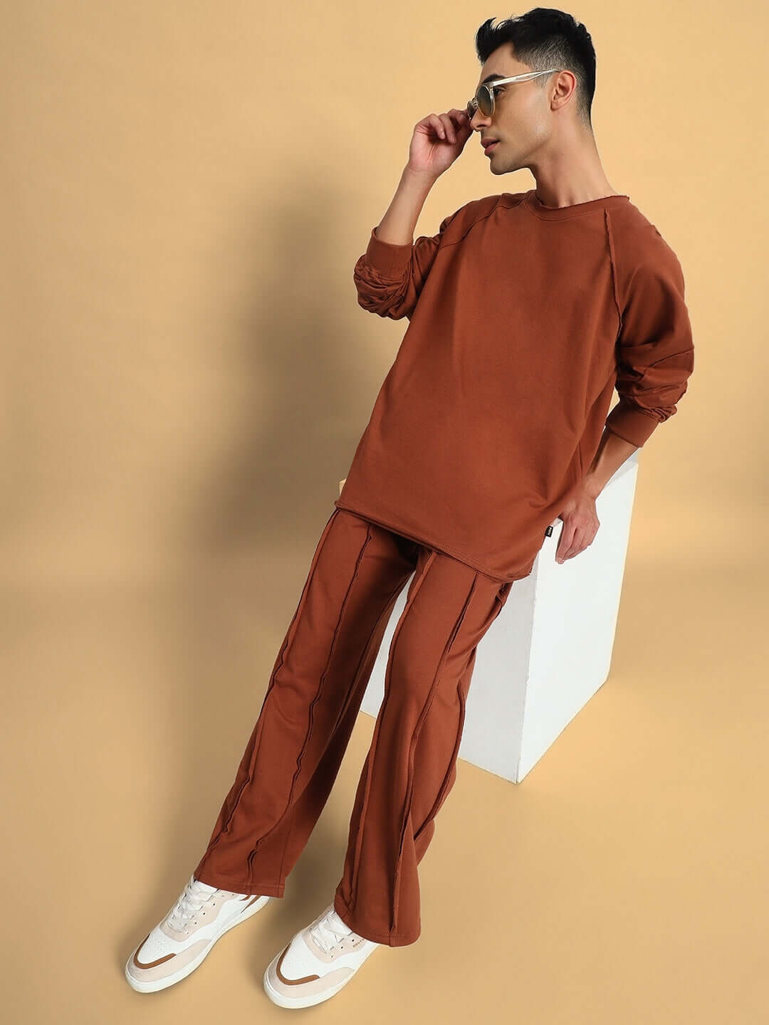 Model wearing Lamina oversized brown co-ord set with joggers and customizable fit, showcasing unisex relaxed fit clothing.