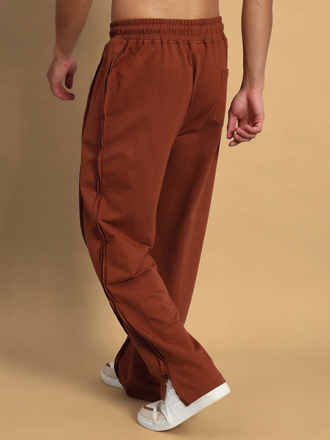 Back view of brown Lamina Side Slit Joggers, showcasing tailored fit and style, perfect for custom sizing options.