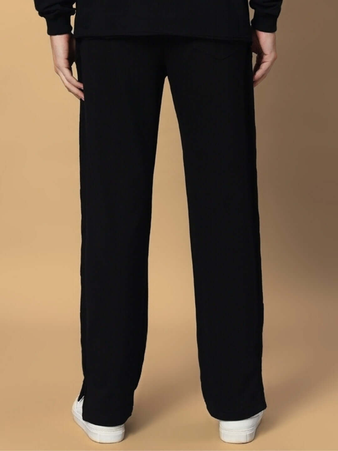 Back view of Lamina Side Slit Joggers in black, featuring a relaxed fit and made-to-order for a custom fit option by DUDS.
