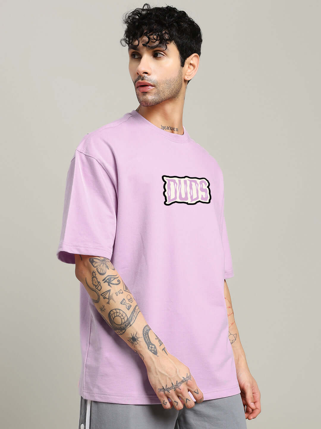 Model wearing LET'S GET SPOOKY PRINTED OVERSIZED T-SHIRT LAVENDER, showcasing streetwear style, perfect for quirky fashion lovers. 