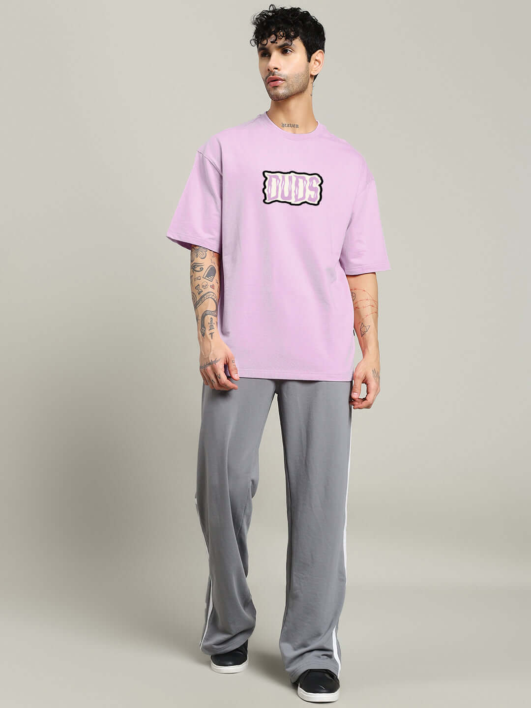 Model wearing LET'S GET SPOOKY PRINTED OVERSIZED T-SHIRT LAVENDER, showcasing streetwear style and seasonal fun.