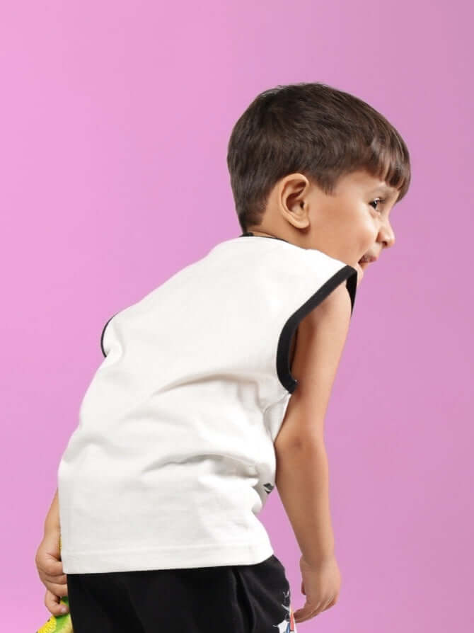 Child wearing off-white Lazio t-shirt for boys & girls against pink background, showcasing casual style.