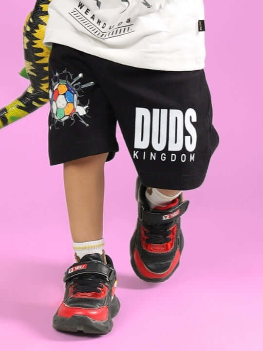 Child wearing black Lazio shorts by DUDS, showcasing comfort and style for boys and girls.