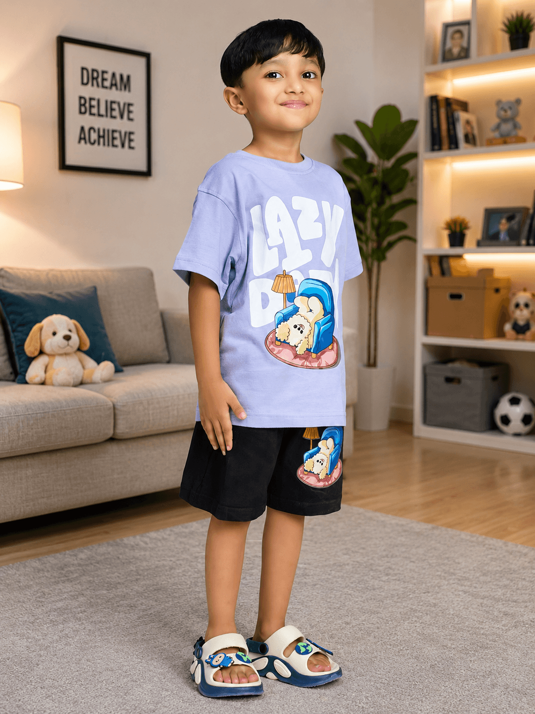 Boy wearing LAZY DAY CO-ORD FOR BOYS GIRLS LAVENDER BLACK in a cozy living room.