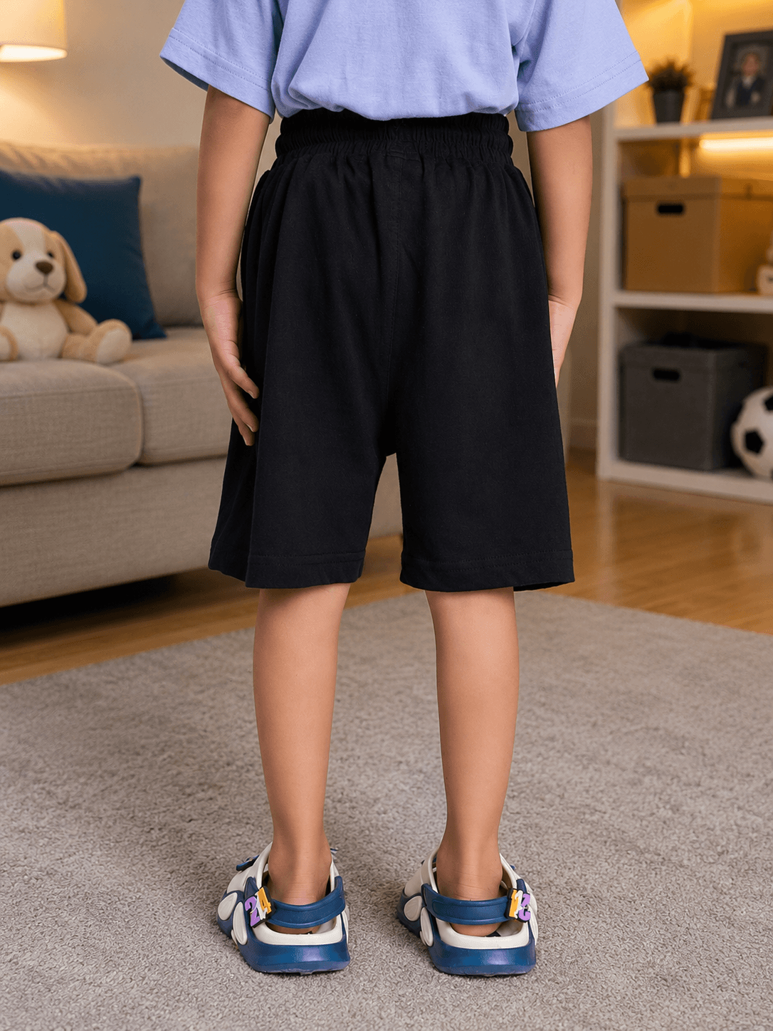 LAZY DAY COOL SHORTS FOR BOYS GIRLS BLACK worn by a child from the back, showcasing comfort and style.