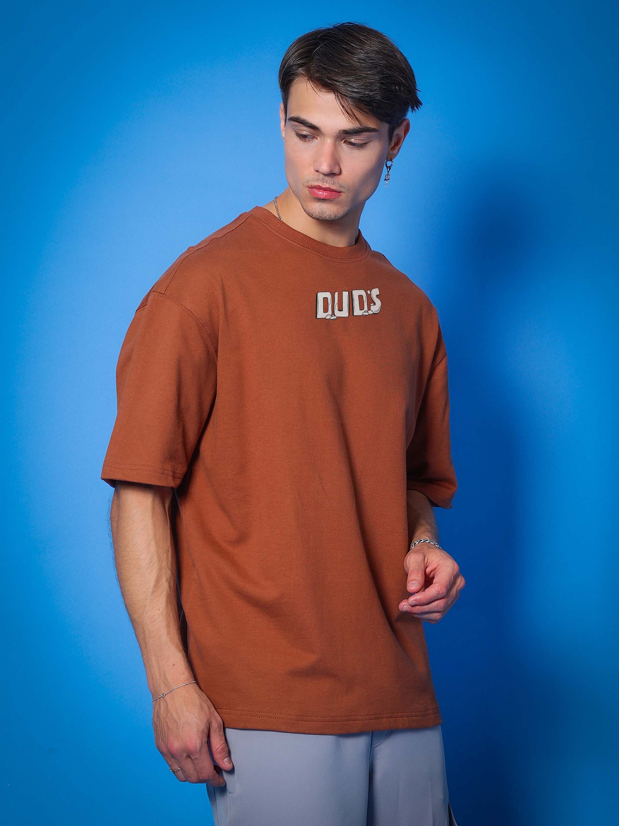 Over-sized brown t-shirt in premium cotton fabric featuring 'Let's Rock' design, made in India, ideal for casual wear.