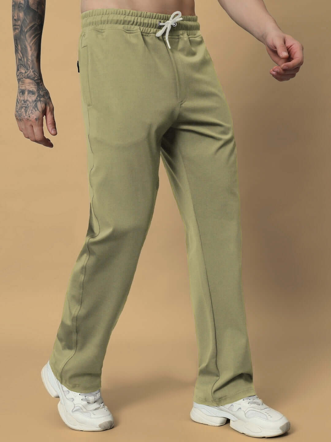 Man wearing olive green relaxed pant jogger from DUDS, showcasing comfortable fit and casual style.