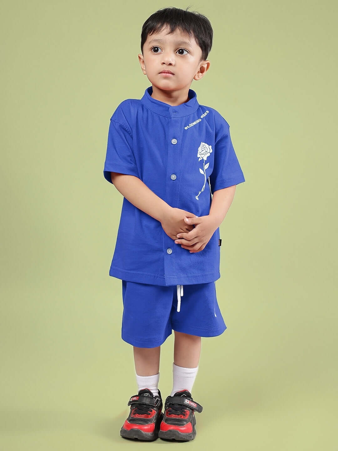 Child wearing LIMBO CO-ORD FOR BOYS & GIRLS BLUE, featuring a blue shirt and shorts set, perfect for comfort and style.