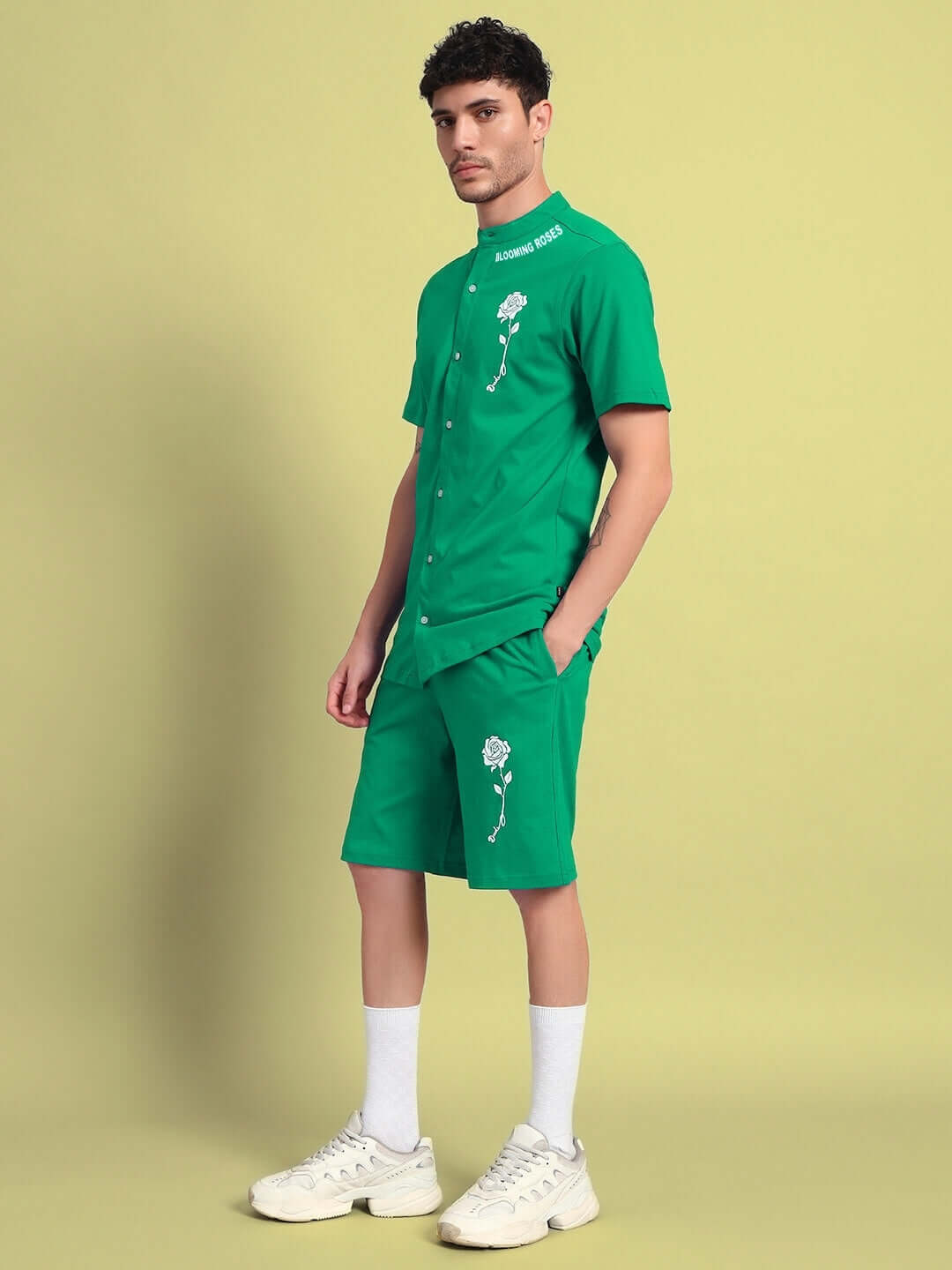 Model wearing green LIMBO CO-ORD SET made of premium cotton French terry and elastane, featuring stylish embroidered design.