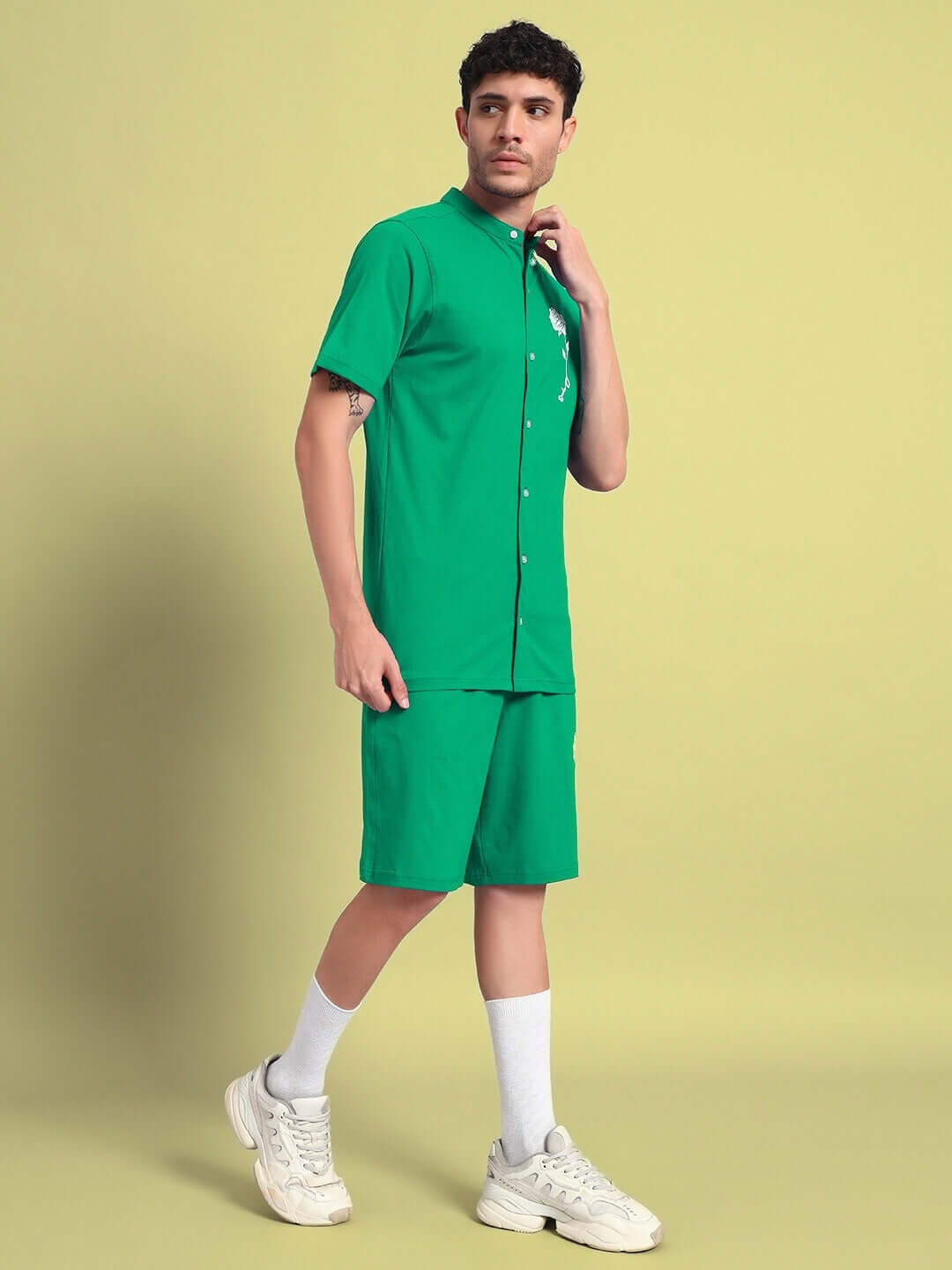 Model wearing green LIMBO Co-Ord Set with premium cotton shirt and shorts, bio-washed in India, against a light background.