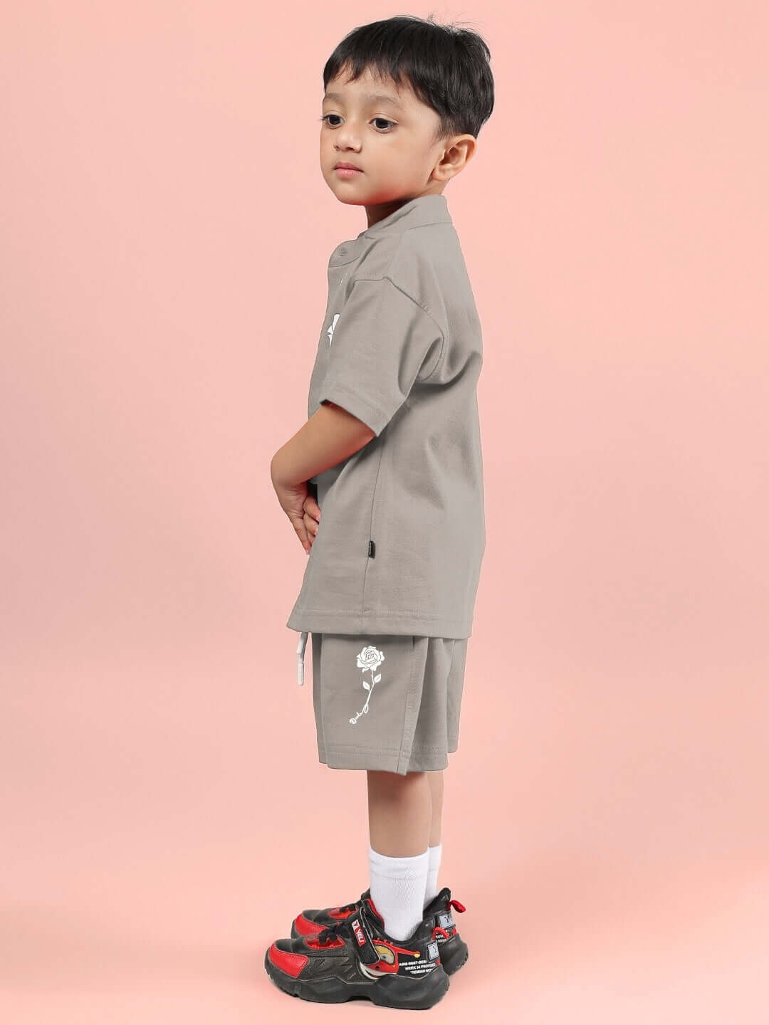 Young child wearing LIMBO CO-ORD FOR BOYS & GIRLS GREY, a stylish cotton-blend shirt and shorts, perfect for comfort and active play.