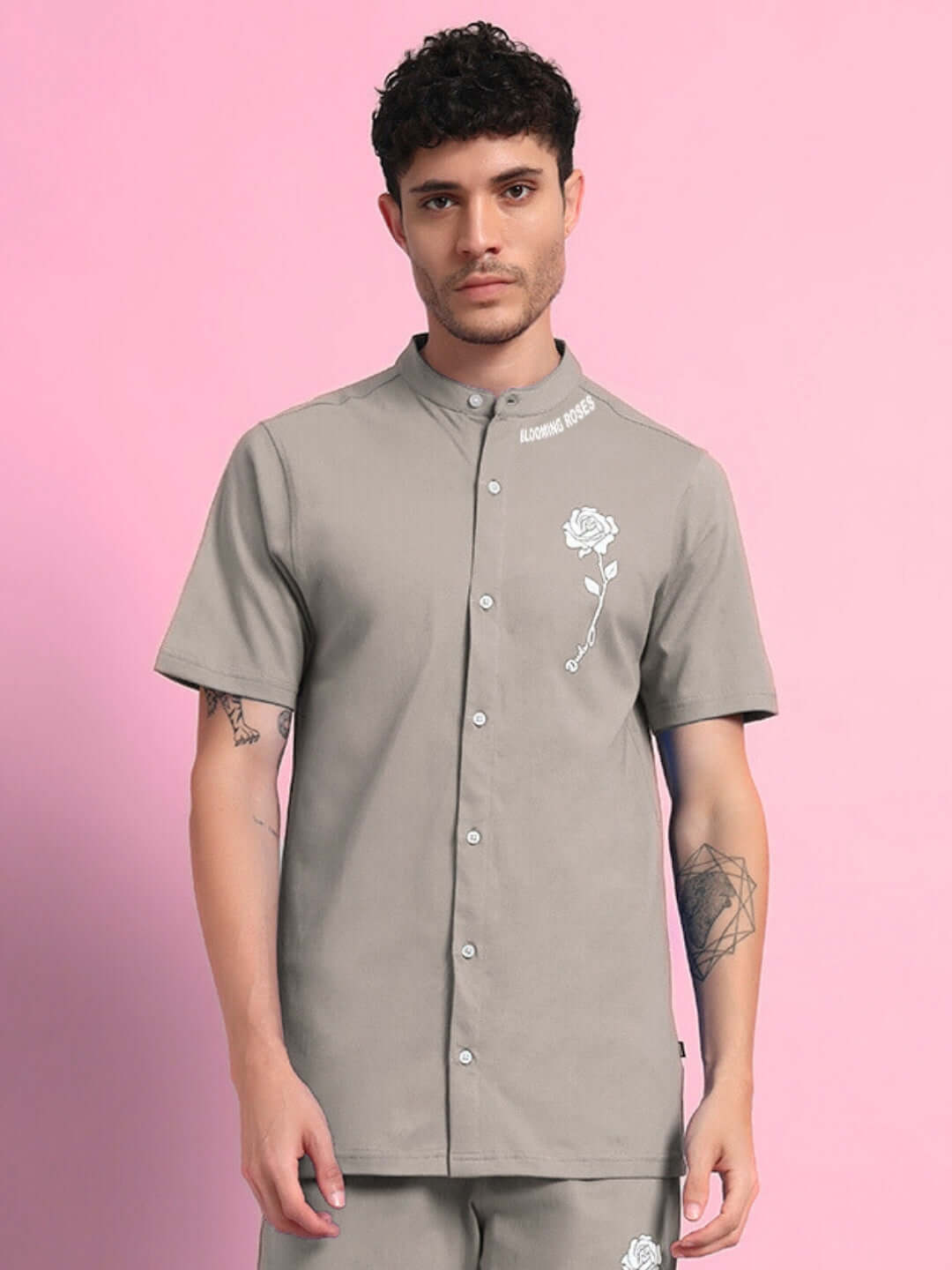 Model wearing LIMBO Regular Fit Shirt in grey, made of 97% premium cotton and 3% elastane, featuring a rose graphic on a pink backdrop.
